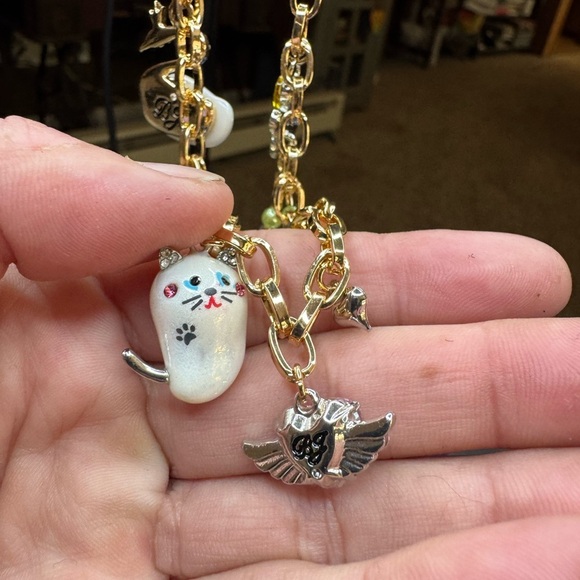 Betsey Johnson Gold Charm Necklace with Cat and Wing Pendants - Picture 4 of 12